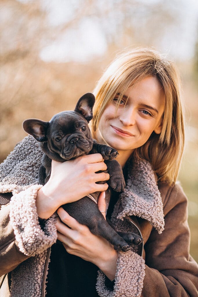 Woman with french bulldog